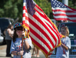 People carrying flag for showing love